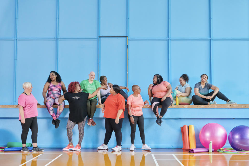 Portrait of a group of women socialising at a sports centre. Regular exercise can help alleviate mental and physical symptoms of menopause. (Getty)