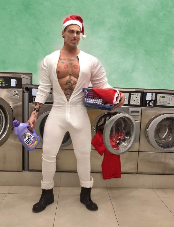 A photo of Neven Ciganovic from Zagreb, Croatia, wearing white longjohns and a Santa hat in a laundromat.