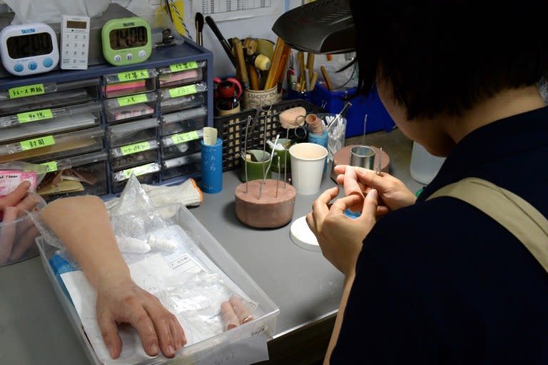 A prosthetics technician prepares a silicone-made finger at specialist Shintaro Hayashi's office in Tokyo, on May 27, 2013. Going straight after a lifetime spent as a member of Japan's feared yakuza organised crime mobs poses a number of challenges. Chief among them is what to do about the fingers you chopped off