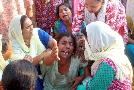 Women mourn the death of Ravi Paul, an Indian army soldier who was killed in Sunday's attack at an Indian army base in Kashmir's Uri, before his funeral in Sarwa village in Samba district, south of Jammu, September 19, 2016. REUTERS/Mukesh Gupta