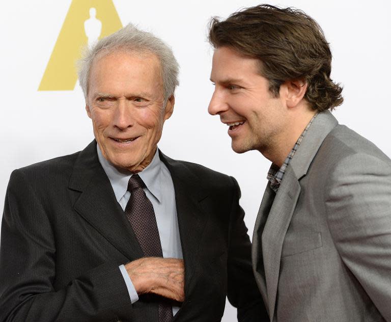 Director Clint Eastwood (L) and actor Bradley Cooper arrive for the Oscars Nominees' Luncheon hosted by the Academy of Motion Picture Arts and Sciences, February 2, 2015, at the Beverly Hilton Hotel in Beverly Hills, California