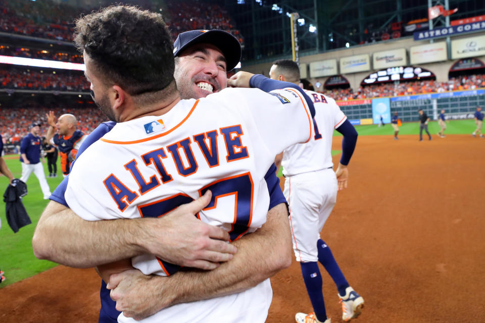 HOUSTON, TX - OCTOBER 19:  Jose Altuve #27 of the Houston Astros celebrates with Justin Verlander #35 after hitting a two-run walk-off home run to win the ALCS and advance the Houston Astros to the World Series during the ninth inning of Game 6 of the ALCS between the New York Yankees and the Houston Astros. The Astros defeated the Yankees 6-4 at Minute Maid Park on Saturday, October 19, 2019 in Houston, Texas. (Photo by Alex Trautwig/MLB Photos via Getty Images)