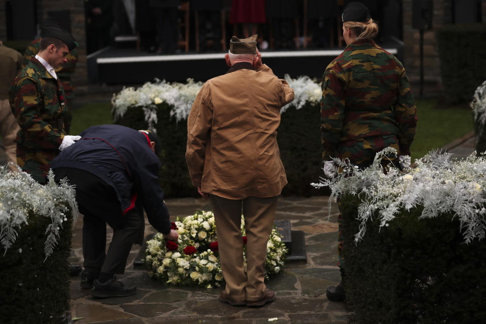 U.S. Battle of the Bulge veterans put flowers to pay tribute during a ceremony to commemorate the 75th anniversary of the Battle of the Bulge at the Mardasson Memorial in Bastogne, Belgium on Monday, Dec. 16, 2019. The Battle of the Bulge, also called Battle of the Ardennes, took place between Dec. 1944 and Jan. 1945 and was the last major German offensive on the Western Front during World War II. (AP Photo/Francisco Seco)