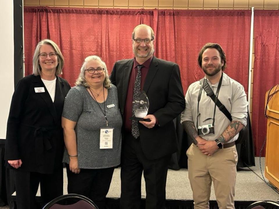 (From left) Tracy Beckley, Kristine Holmes, Don Heinz and Jeremy Tollas pose after receiving the MAEO Alternative Education School of the Year award.
