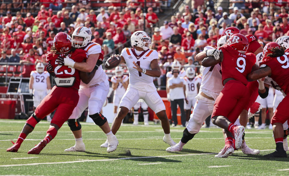 Virginia Tech quarterback Kyron Drones (1) throws a pass during the first half of an NCAA college football game against Rutgers, Saturday, Sept. 16, 2023, in Piscataway, N.J. (Andrew Mills/NJ Advance Media via AP)