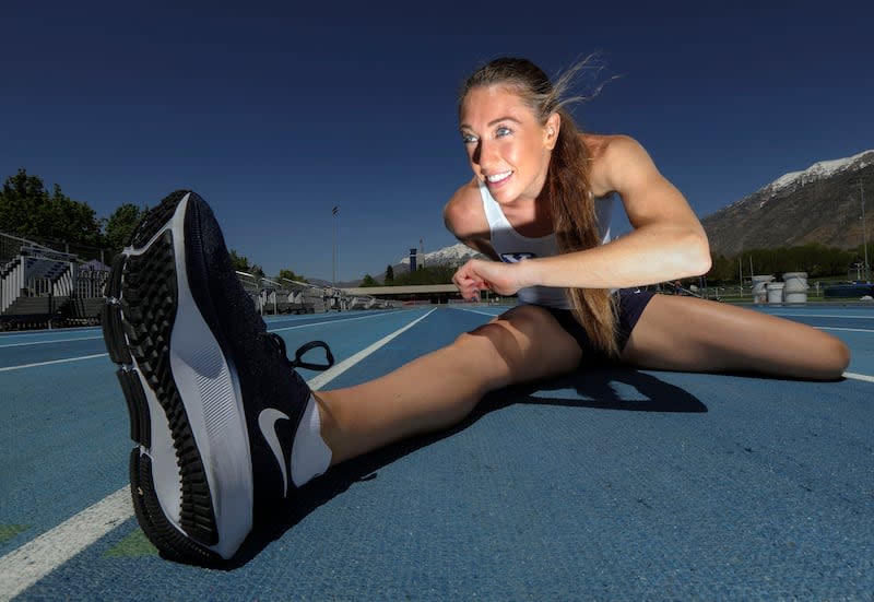BYU track athlete Courtney Wayment stretches at the Robison Track and Field Complex in Provo, Utah, on May 5, 2021.