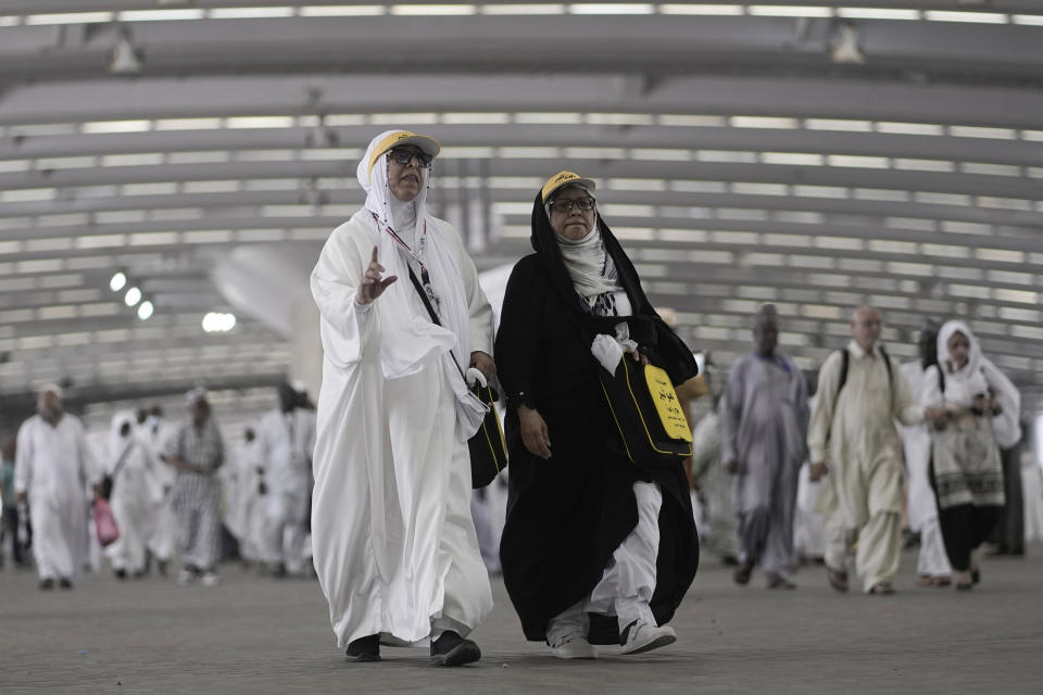 Iranian pilgrims walk to cast stones at a pillar in the symbolic stoning of the devil, the last rite of the annual Hajj pilgrimage, in Mina near the holly city of Mecca, Saudi Arabia, Thursday, June 29, 2023. (AP Photo/Amr Nabil)