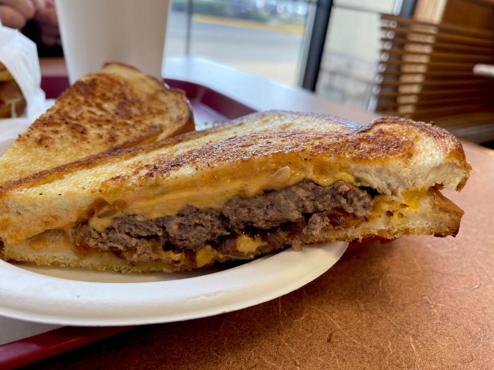 The patty melt features a patty on Texas toast with melted American cheese, Thousand Island dressing and caramelized onions.