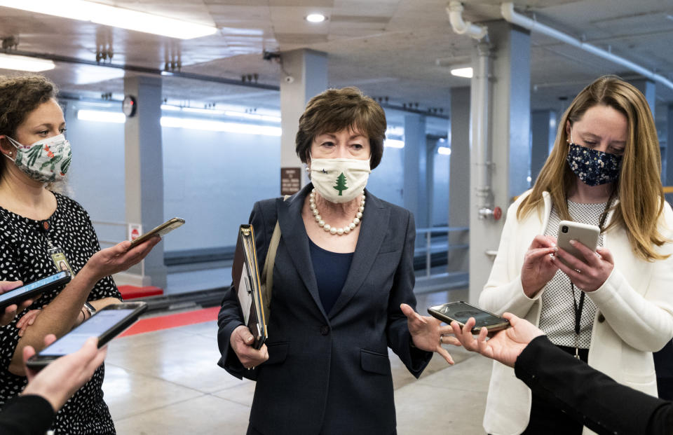 Sen. Susan Collins (R-Maine) speaks with reporters in the Senate subway after a vote in the Capitol on Jan. 26, 2021.  (Photo: Bill Clark via Getty Images)