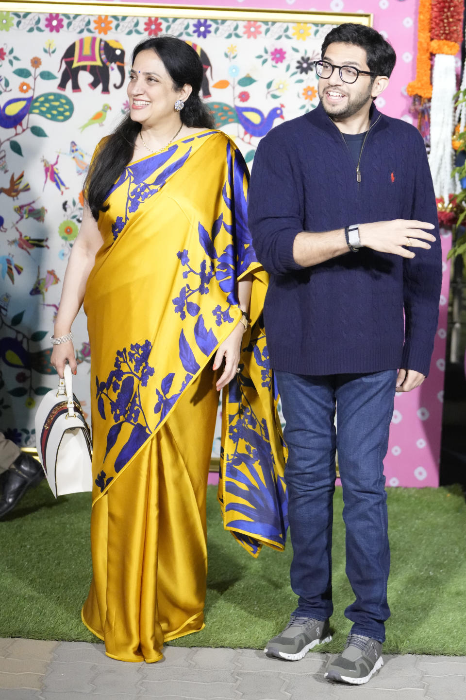 Former Maharashtra Chief minister Uddhav Thackeray's wife Rashmi Thackeray, left and son Aaditya Thackeray pose for media as they arrive to attend the pre-wedding celebrations of Anant Ambani and Radhika Merchant in Jamnagar, India, Thursday, Feb. 29, 2024. (AP Photo/Ajit Solanki)