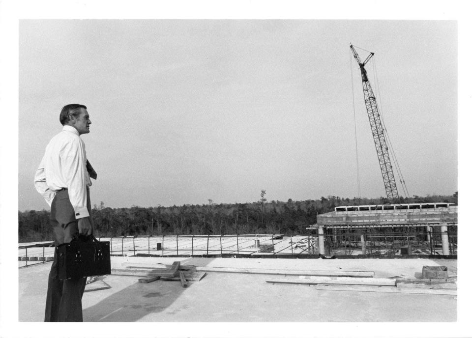 President Thomas G. Carpenter standing on the roof of Building 1 during construction in 1972, the year the University of North Florida opened.