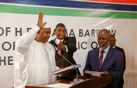 The swearing-in ceremony at the inauguration of Gambia President Adama Barrow at the Gambian embassy in Dakar, Senegal January 19, 2017, is seen in this handout photo provided by Office of the Senegal Presidency. REUTERS/Office of the Senegal Presidency/Handout