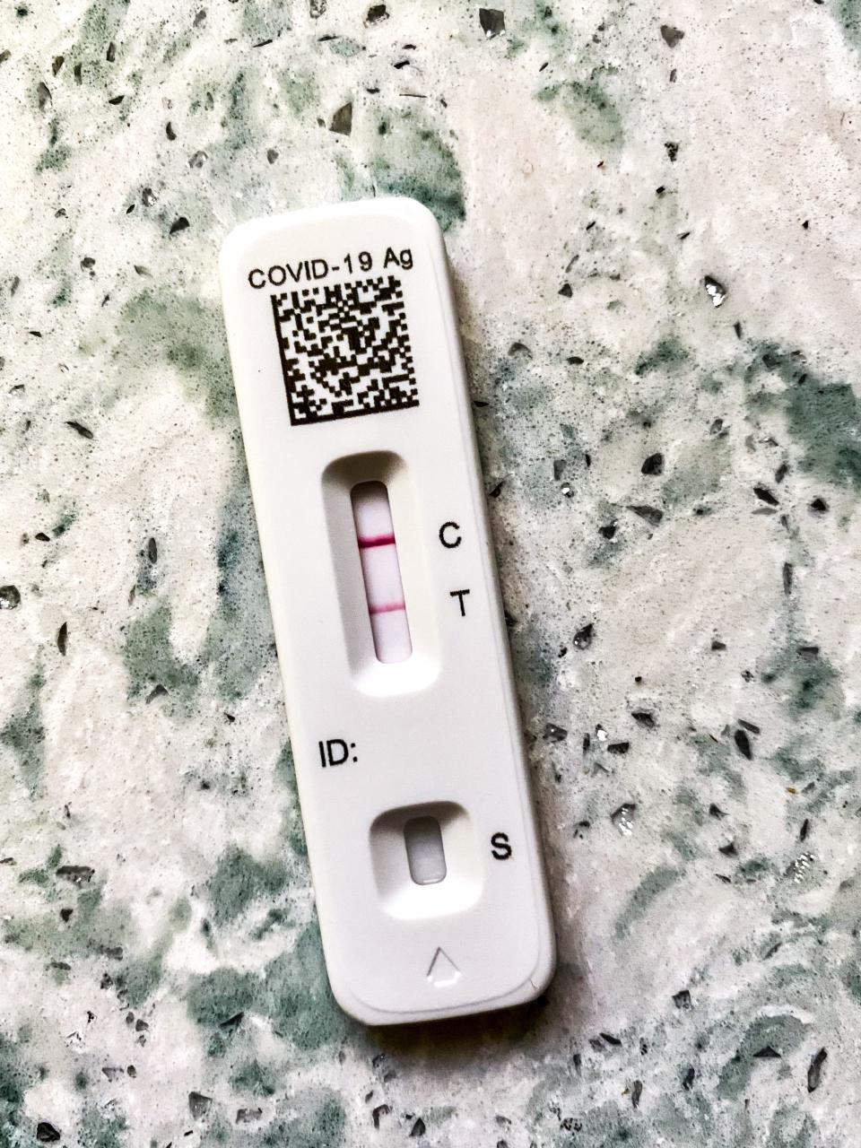 A COVID home test showing the dreaded two bars that indicate a positive reading for the virus.