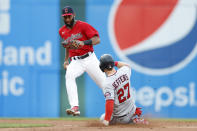 Cleveland Guardians shortstop Amed Rosario, top, forces out Minnesota Twins' Ryan Jeffers (27) at second base during the fourth inning of a baseball game Monday, June 27, 2022, in Cleveland. (AP Photo/Ron Schwane)