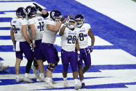 Northwestern running back Cam Porter (20) celebrates after scoring during the first half of the Big Ten championship NCAA college football game against Ohio State, Saturday, Dec. 19, 2020, in Indianapolis. (AP Photo/Darron Cummings)