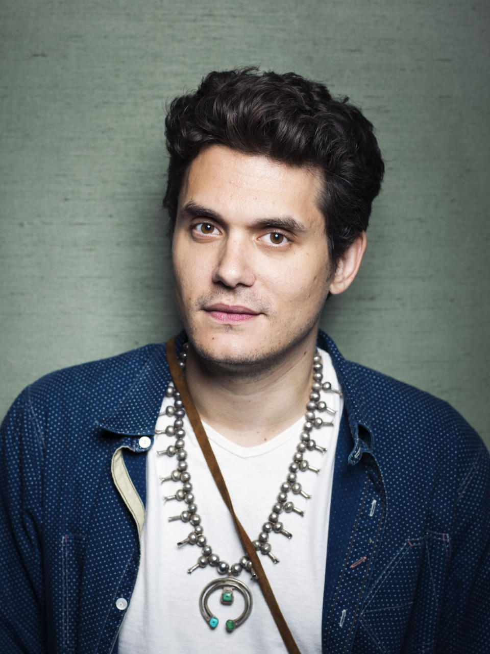 This Aug. 12, 2013 file photo shows singer-songwriter John Mayer poses in New York. Mayer is releasing his sixth album, “Paradise Valley,” on Tuesday, Aug. 20. It features collaborations with his singer-girlfriend Katy Perry and R&B singer Frank Ocean. (Photo by Victoria Will/Invision/AP)