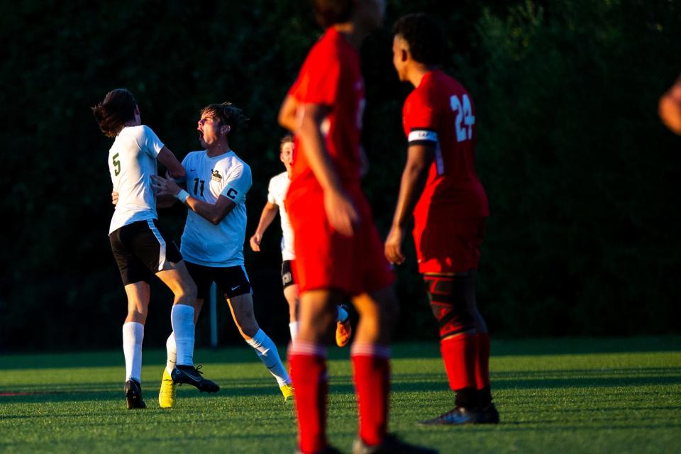 Zeeland West celebrates a goal to close the gap against Holland Tuesday, Sept. 6, 2022, at Holland High School. 