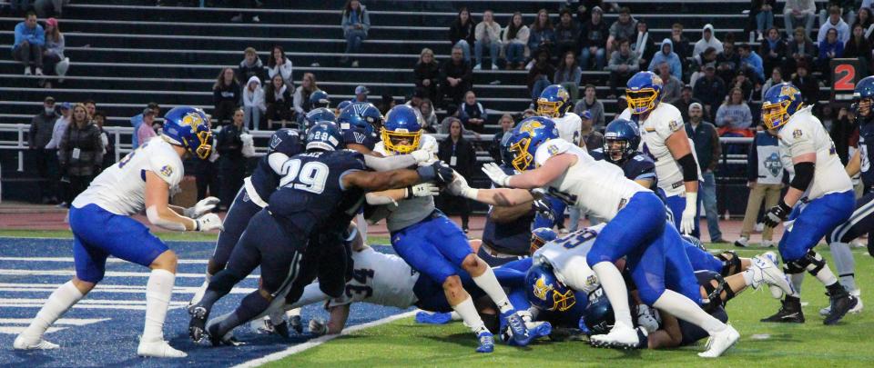 Isaiah Davis fights his way into the end zone for a touchdown to tie the game in the third quarter.