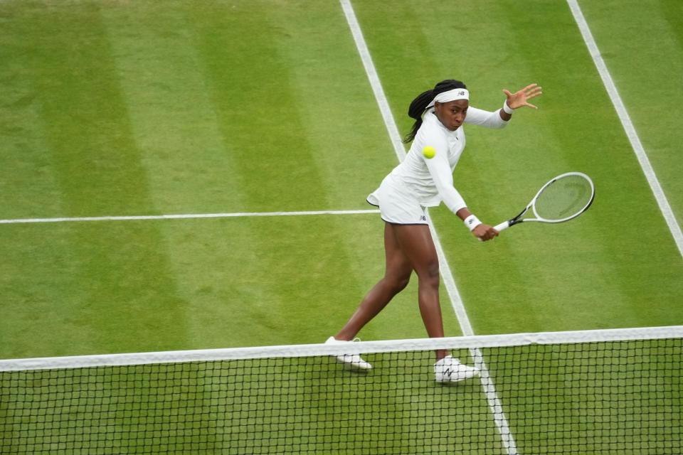 Coco Gauff of the U.S. plays against Russia's Veronika Kudermetova and Elena Vesnina during the women's doubles third round match on day eight of the Wimbledon Tennis Championships in London, Tuesday, July 6, 2021. (AP Photo/Alberto Pezzali)