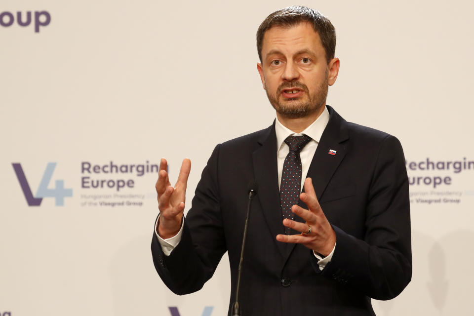 Prime Minister Eduard Heger of Slovakia addresses media at a news briefing in Budapest, Hungary, Tuesday, Nov. 23, 2021. The leaders of the Visegrad Four group of Central European countries met in Hungary's capital of Budapest Tuesday to discuss the ongoing migration crisis along Poland's border with Belarus. (AP Photo/Laszlo Balogh)