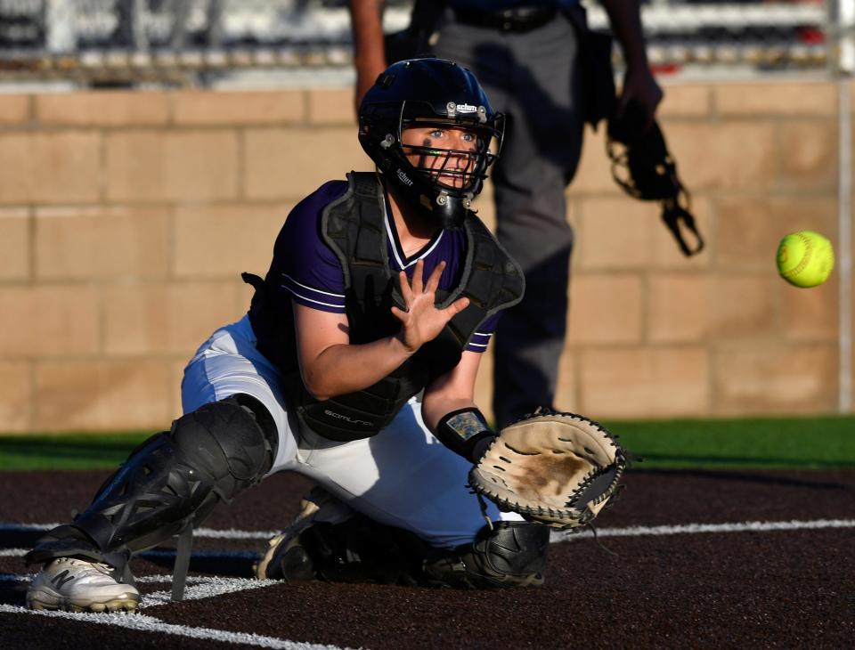 Wylie catcher Cameron Gregory faces into the sun to catch a throw to home plate against Cooper on April 6.