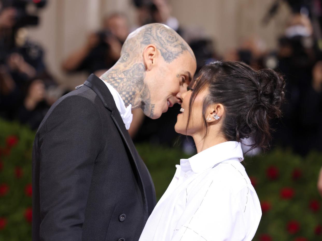 Travis Barker and Kourtney Kardashian attend the 2022 Met Gala.