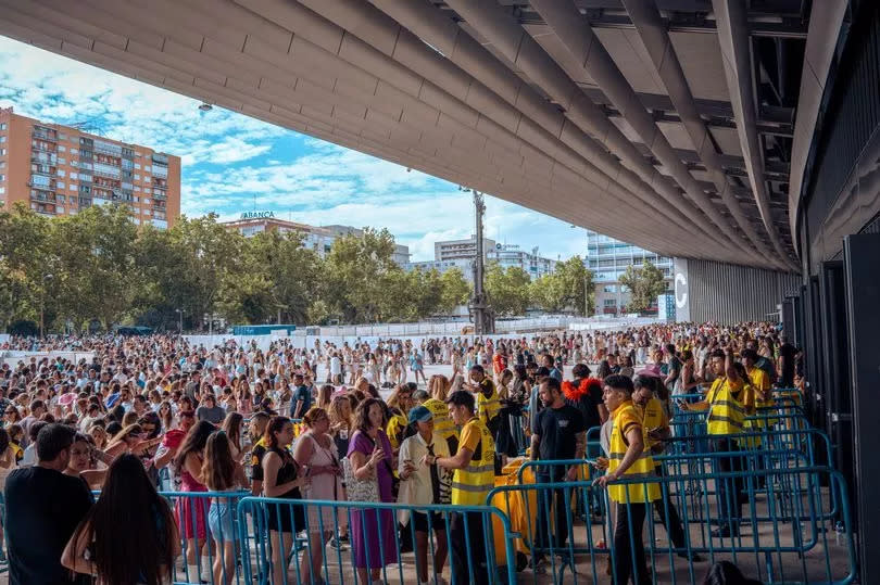 Hundreds of fans queue to enter the concert in the vicinity of the Santiago Bernabeu Stadium