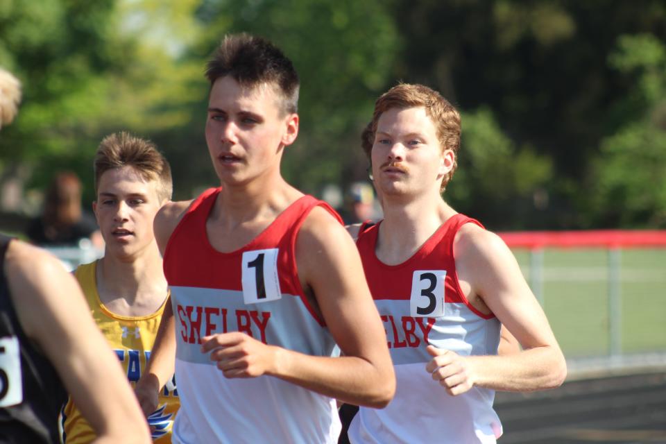 Shelby's Huck Finnegan (left) won the 1,600, while teammate Luke Dininger (right) finished third at the MOAC track meet.