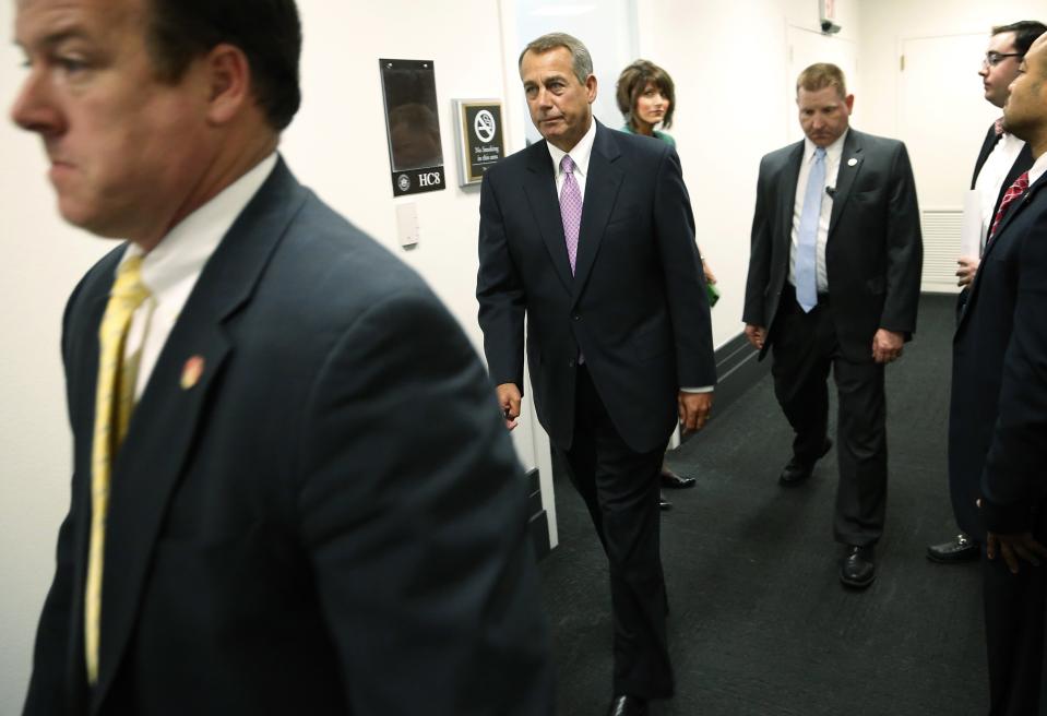 Boehner departs from news conference after a House Republican caucus meeting at the U.S. Capitol in Washington