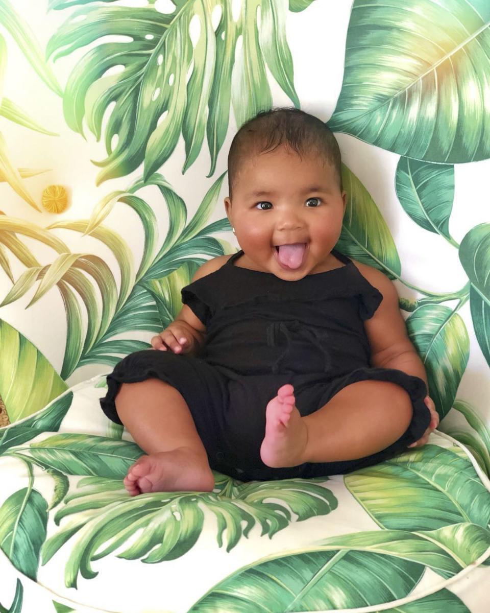 Looks like baby True is OOO! Khloé's daughter, who turns 5 months old on Sept. 12, seemed to be in full vacation mood in a photo Khloé <a href="https://people.com/parents/khloe-kardashian-daughter-true-dressing-room-decorations/" rel="nofollow noopener" target="_blank" data-ylk="slk:posted to Instagram;elm:context_link;itc:0;sec:content-canvas" class="link ">posted to Instagram</a> of her posing on a tropical leaf print chair. 