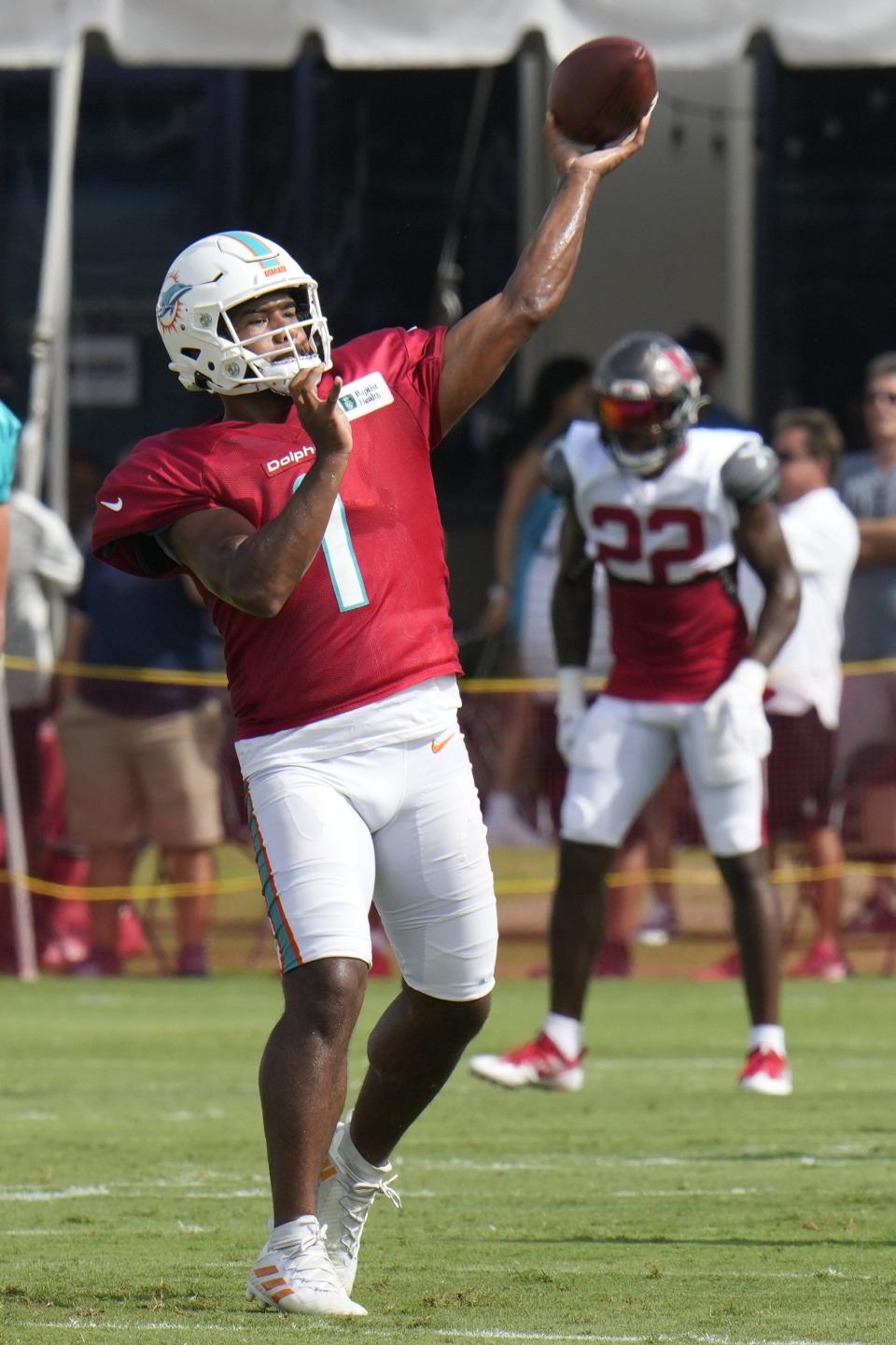 Dolphins quarterback Tua Tagovailoa throws a pass during Wednesday's workout vs. the Buccaneers in Tampa.