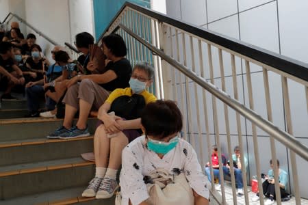 Seniors take part in a 48-hour quiet sit-in protest in front of the police headquarters in Hong Kong