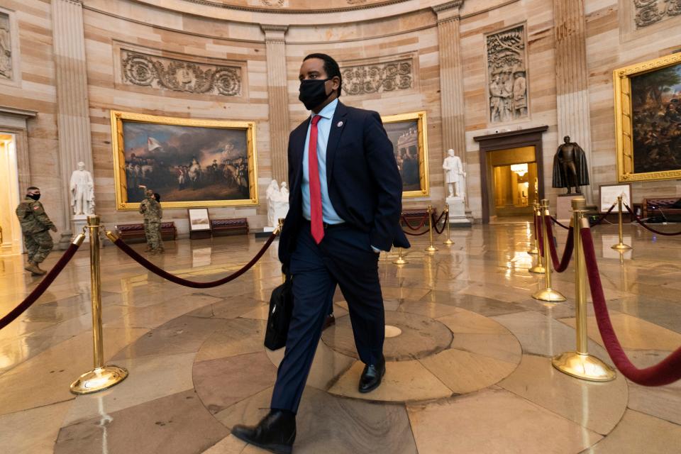 House impeachment manager Rep. Joe Neguse, D-Colo., walks through the Capitol Rotunda from the Senate on Capitol Hill in Washington, D.C. on Feb. 11, 2021.