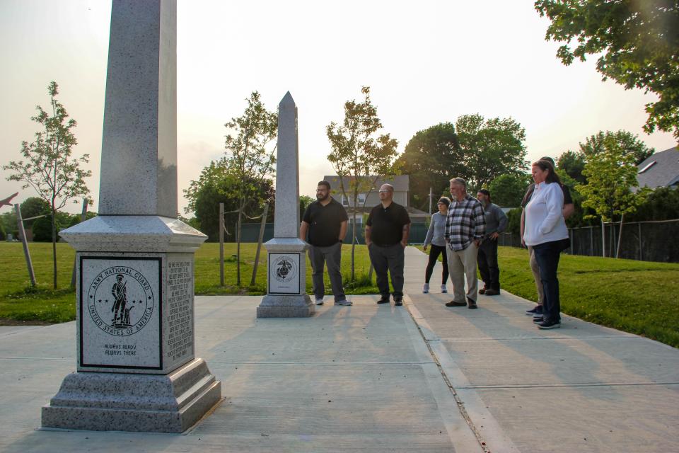 Members of the Fall River Park Board, Community Preservation Committee and city government view obelisks installed in Oak Grove Cemetery.