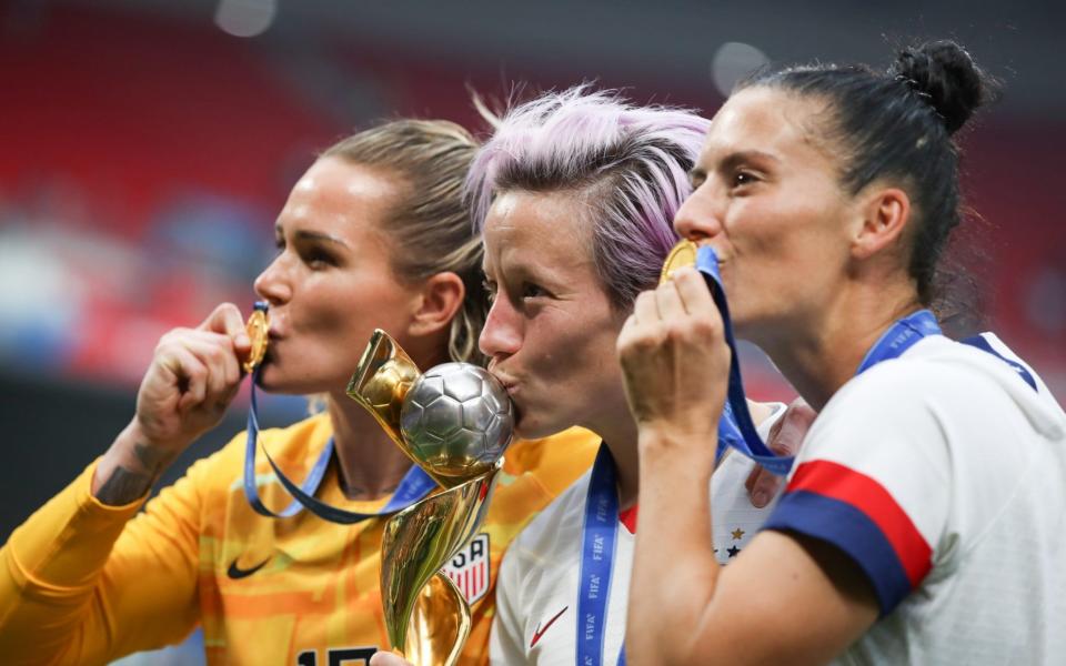 Ashlyn Harris, Megan Rapinoe and Ali Krieger celebrate their World Cup success in France - Getty Images