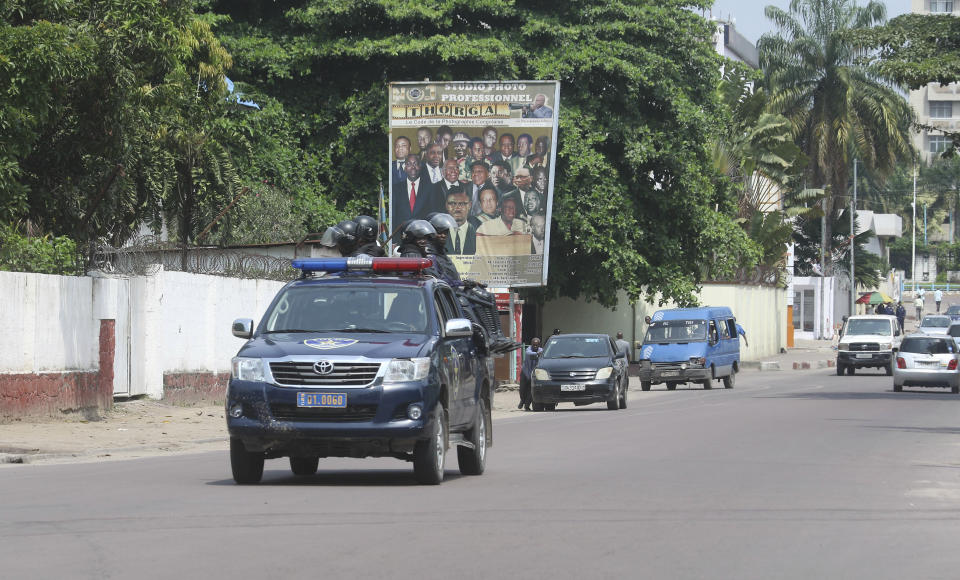 Congolese police patrol in Kinshasa, Congo, Monday, Dec. 19, 2016. Military and police units are deployed across the capital of Congo amid fears of unrest on the last official day of President Joseph Kabila's mandate. Kabila intends to stay on after the midnight deadline, as a court has ruled he can stay in power until new elections are held. (AP Photo/John Bompengo)