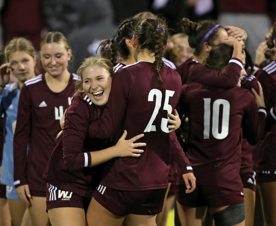 Walsh Jesuit's Lexi Pascarella, facing, celebrates with Abby Witkiewicz after beating Olentangy Liberty in the OHSAA Division I girls soccer state championship game Friday in Columbus.