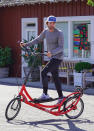 <p>Patrick Schwarzenegger and his father Arnold take their bikes out for a spin in Los Angeles on Friday.</p>