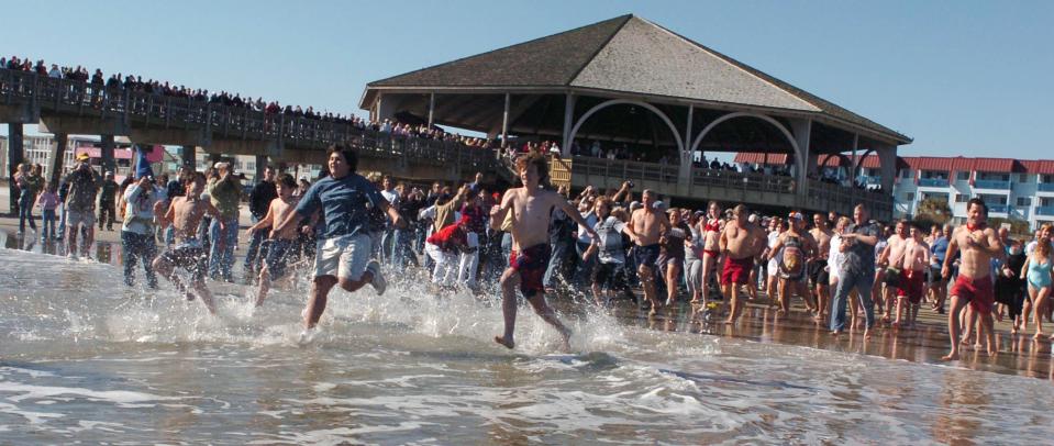 Hundreds turned out to watch as participants braved the chilly water near the Tybee Island pier during the annual Polar Bear Plunge.