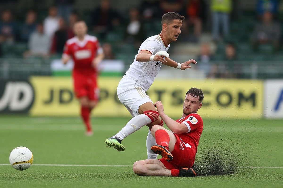 Newtown’s Jake Thomas Walker (right) during Europa Conference League tie against Spartak Trnava in July. The Welsh Premier play-offs are set to take place on the day of the King’s coronation on May 6 (Barrington Coombs/PA) (PA Wire)