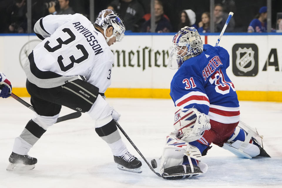 New York Rangers goaltender Igor Shesterkin (31) stops a shot on goal by Los Angeles Kings' Viktor Arvidsson (33) during the first period of an NHL hockey game Sunday, Feb. 26, 2023, in New York. (AP Photo/Frank Franklin II)
