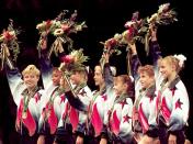 FILE - In this July 23, 1996, file photo, members of the United States women's gymnastics team wave to the crowd after being awarded their gold medals in the team competition at the Centennial Summer Olympic Games in Atlanta. From left are Amanda Borden, Dominique Dawes, Amy Chow, Jaycie Phelps, Dominique Moceanu, Kerri Strug, and Shannon MIller. (AP Photo/John Gaps III, File)