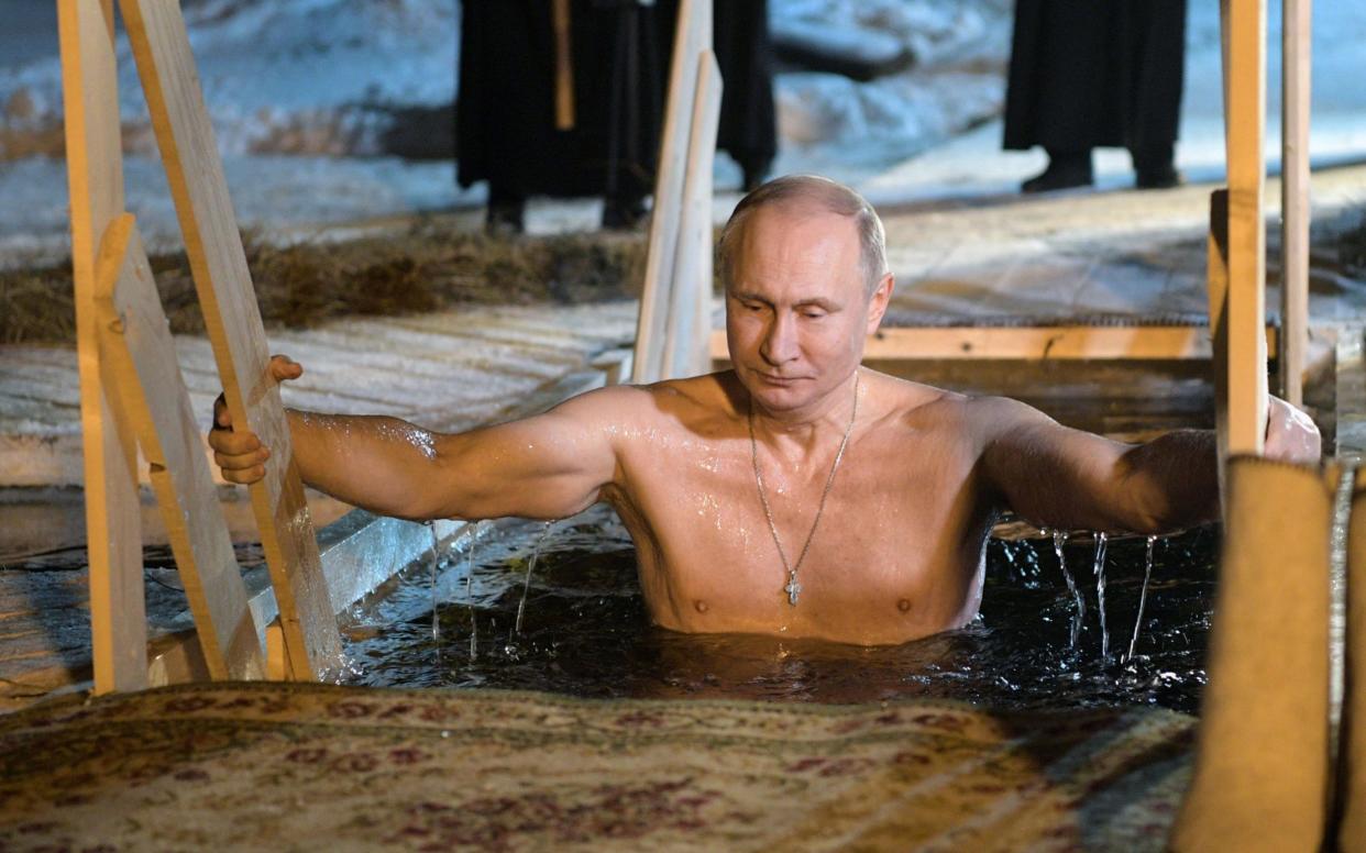 Vladimir Putin too part in the freezing ritual to mark the Orthodox Christian ritual to mark the feast of Epiphany - AFP