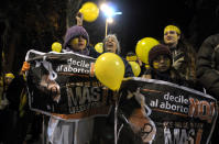People demonstrate against abortion legalization in downtown Montevideo, Uruguay, Monday, Sept. 24, 2012. Demonstrators protested the day before a congressional bill legalizing abortion is voted on. The signs read in Spanish "not to abortion." (AP Photo/Matilde Campodonico)
