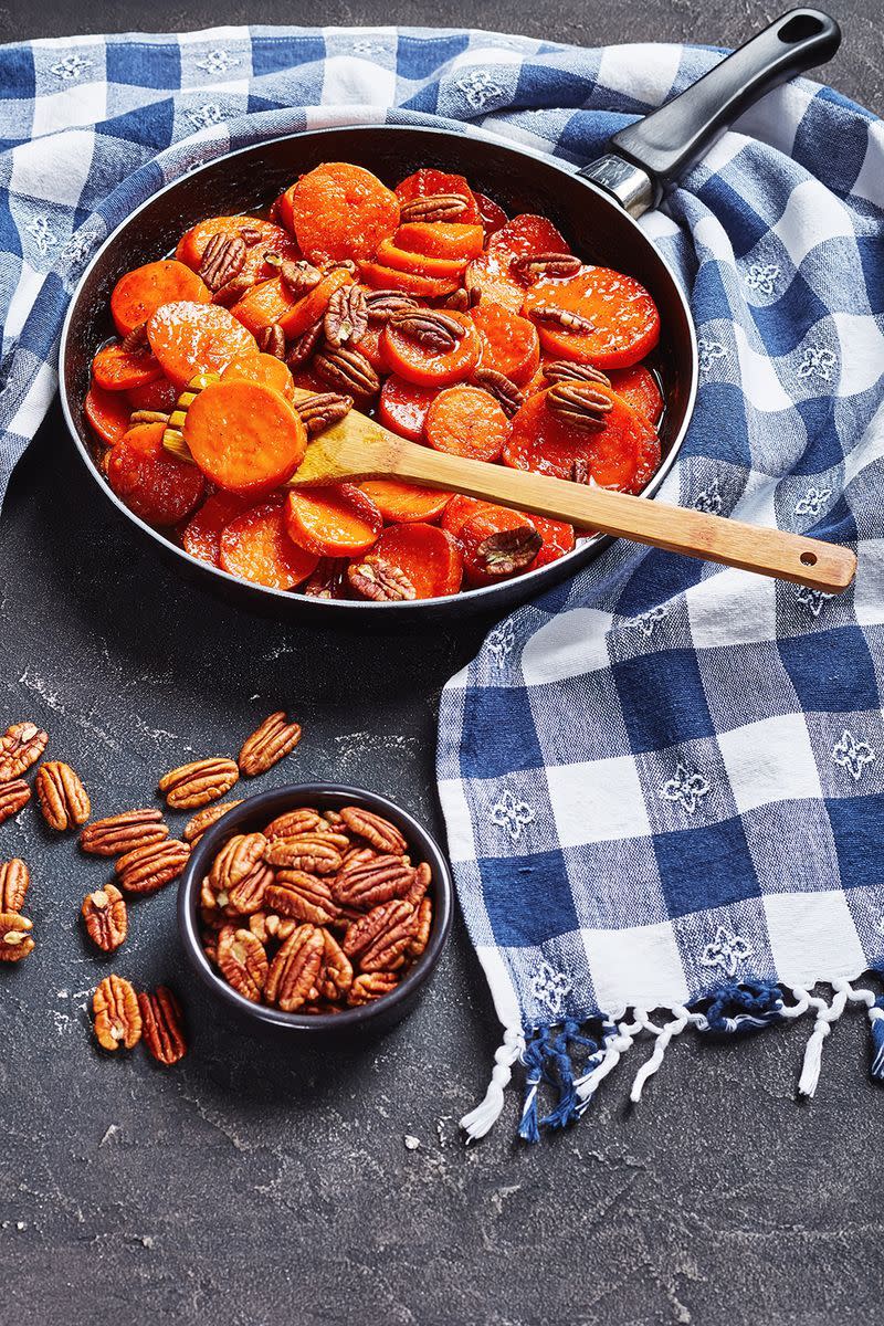 <p>Pecan fans will go wild for these tasty maple-glazed sweet potatoes.</p><p><a href="https://www.womansday.com/food-recipes/food-drinks/recipes/a18535/maple-glazed-sweet-potatoes-pecans-rbk1107/" rel="nofollow noopener" target="_blank" data-ylk="slk:Get the recipe for Maple-Glazed Sweet Potatoes with Pecans.;elm:context_link;itc:0;sec:content-canvas" class="link "><em>Get the recipe for Maple-Glazed Sweet Potatoes with Pecans.</em></a></p>