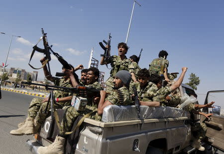 Houthi militants ride on the back of a patrol truck at the site of a gathering held by tribesmen loyal to the Houthi movement, in Yemen's capital Sanaa December 14, 2015. REUTERS/Khaled Abdullah