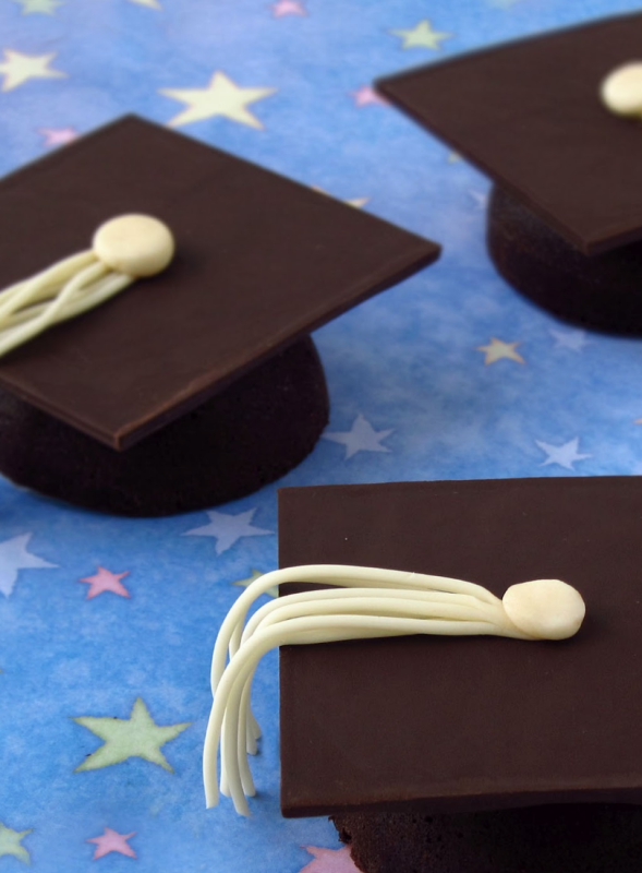 <p>Hungry Happenings</p><p>These decadently creamy flourless chocolate cake graduation caps will not disappoint! Each mini chocolate cake topped with a square of chocolate is decorated with white modeling chocolate to look like a mortarboard.</p><p><strong>Get the recipe: <a href="https://hungryhappenings.com/luscious-and-creamy-flourless-chocolate/" rel="nofollow noopener" target="_blank" data-ylk="slk:Flourless Chocolate Cake Graduation Caps;elm:context_link;itc:0;sec:content-canvas" class="link rapid-noclick-resp">Flourless Chocolate Cake Graduation Caps</a></strong></p>