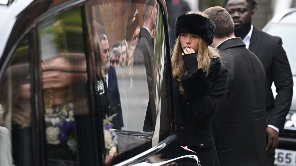 Darcey Draper prepares to carry her father's coffin