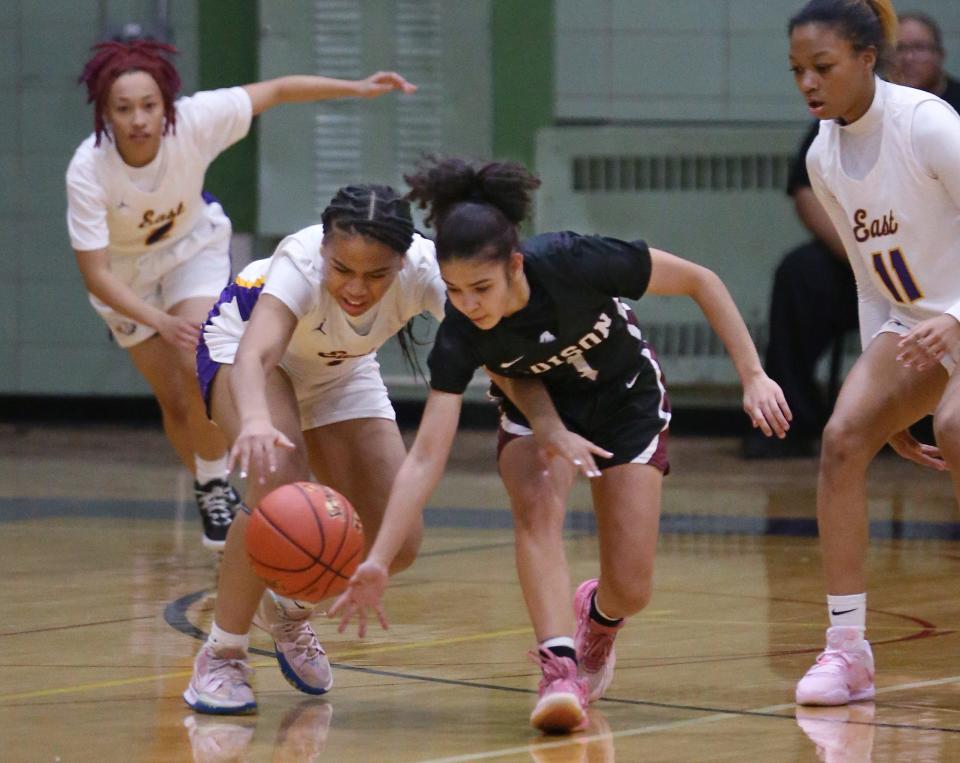 East's Ali'Yana Robinson (1), left, goes for a steal on Edison's Gabriela Lopez (1), right, in the opening quarter during their Section V girls basketball matchup Wednesday, Dec. 21, 2022 at East High in Rochester.