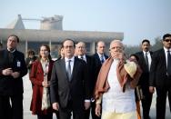 <p>French President Francois Hollande (C) walks with Indian Prime Minister Narendra Modi (3rd R) during their visit to the Capitole complex in Chandigarh on January 24, 2016. Hollande is invited to India to be the guest of honour at this year’s Republic Day parade on January 26, the final day of a state visit that is expected to focus on trade and security. </p>